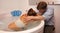 Partner holds pregnant wife in birthing pool