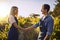 Partnering up to bring quality produce. a young man and woman shaking hands on a farm.