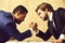 Partnership and teamwork, arm wrestling of businessman and compete man