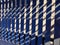 The parts of steel bench and shadow on a brick pavement