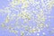 Party composition. Golden stars decorations on purple background. Christmas, winter, new year, birtda concept. Selective