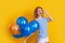 party girl with balloon in sunglasses. caucasian girl hold party balloons in studio