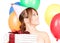 Party girl with balloons and gift box