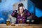 Party girl. Beautiful girl drinking beer. brunette girl toasting and eating in the pub