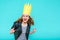 Party girl in leather jacket and party crown on pastel blue background celebrating and dancing. Party, fun, dancing, laughing.