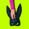 Party Hand holding Fashion black rabbit mask. Gosplay clubbing hipster glamour style concept