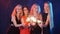 Party, holidays, nightlife and happy new year concept - Group of happy women having fun with sparklers