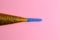 Party noisemaker on a pink background