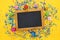 party yellow background with colorful confetti and blackboard