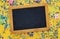 party yellow background with colorful confetti and blackboard