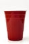 Partying, american drinking games and party supplies concept with red plastic cup isolated on white background with clipping path