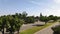 Pasadena neighborhood, rising aerial, cars driving down empty street