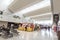 Pasay, Metro Manila, Philippines - Food kiosks and passengers inside the departure area of NAIA Terminal 3