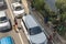 Pasig, Metro Manila, Philippines - Poor people carrying young kids beg for money while motorists are stopped.