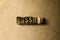 PASSAGE - close-up of grungy vintage typeset word on metal backdrop