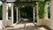 Passage through the garden colonnade with old columns