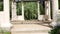 Passage through the garden colonnade with old columns