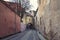 passage in the historical center of the old city of Vilnius Lithuania among the dilapidated brick walls of street of St. Casimir