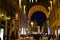 Passage, illuminated in the winter evening, which leads from via degli Strozzi to piazza della Repubblica in Florence.