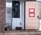 Passage only with a mask, without a mask, entry is prohibited. Three cats sit on the doorstep of a rural store in Ukraine