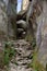 Passage in the narrow gorge between the rocks in the mountains.