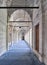 Passage in Nuruosmaniye Mosque, with columns, arches and floor covered with blue carpet lighted by side windows, Istanbul, Turkey