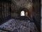 Passage between two parts of the ancient castle with an old stone staircase. Stone arch and steps in the castle. Stone corridor