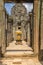 Passageway in Angkor Wat with a small Buddhist shrine