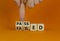 Passed or failed symbol. Businessman turns wooden cubes and changes the word `failed` to `passed` on a beautiful orange table,