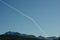 Passenger aircraft vapor trail on blue summer sky