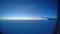 Passenger airliner flying at thousands feet height. Sun rising through clouds