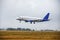 The passenger airliner landed on the airport runway in bad weather with rain