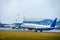 The passenger airliner landed on the airport runway in bad weather with rain