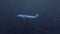 Passenger airliner in night sky at heavy rain