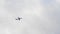 A passenger airliner takes off against a cloudy sky