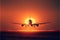 Passenger airliner takes off at sunset. AI generated.