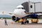 Passenger airplane Airbus A319 of Aurora Airlines prepares for departure. Engineers check aircraft systems.