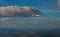 The passenger airplane cruising above the clouds