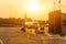 Passenger airplane during push back operation, evening airport at sunset