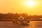 Passenger airplane during push back operation, evening airport at sunset