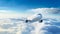 A passenger airplane soaring above a sea of fluffy clouds