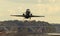 A passenger Airplane is taking off from the runway of an airport at sunset.