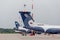 Passenger airplanes Airbus A319 of Aurora Airlines on airfield in cloudy day. Aviation and transportation