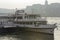 Passenger boat on the Buda Castle background on the Danube River in Budapest, Hungary - Backlight photo