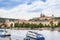 Passenger boat on the cityscape Prague background.