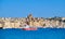 Passenger boat crosses Grand Bay, Valetta, Malta