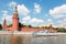 Passenger boat goes across Moscow river in Moscow Kremlin