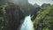 Passenger boats on river with green forested rocky banks aerial. Tropical stream with shallow water