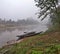 Passenger boats and riverbank gardens along the Namtha River in Luang Namtha, Laos