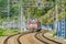 Passenger double deck train moves along the mountains. Sochi